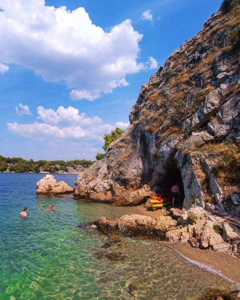 Crystal-clear waters and kayaks by the Croatian coastline in Šibenik