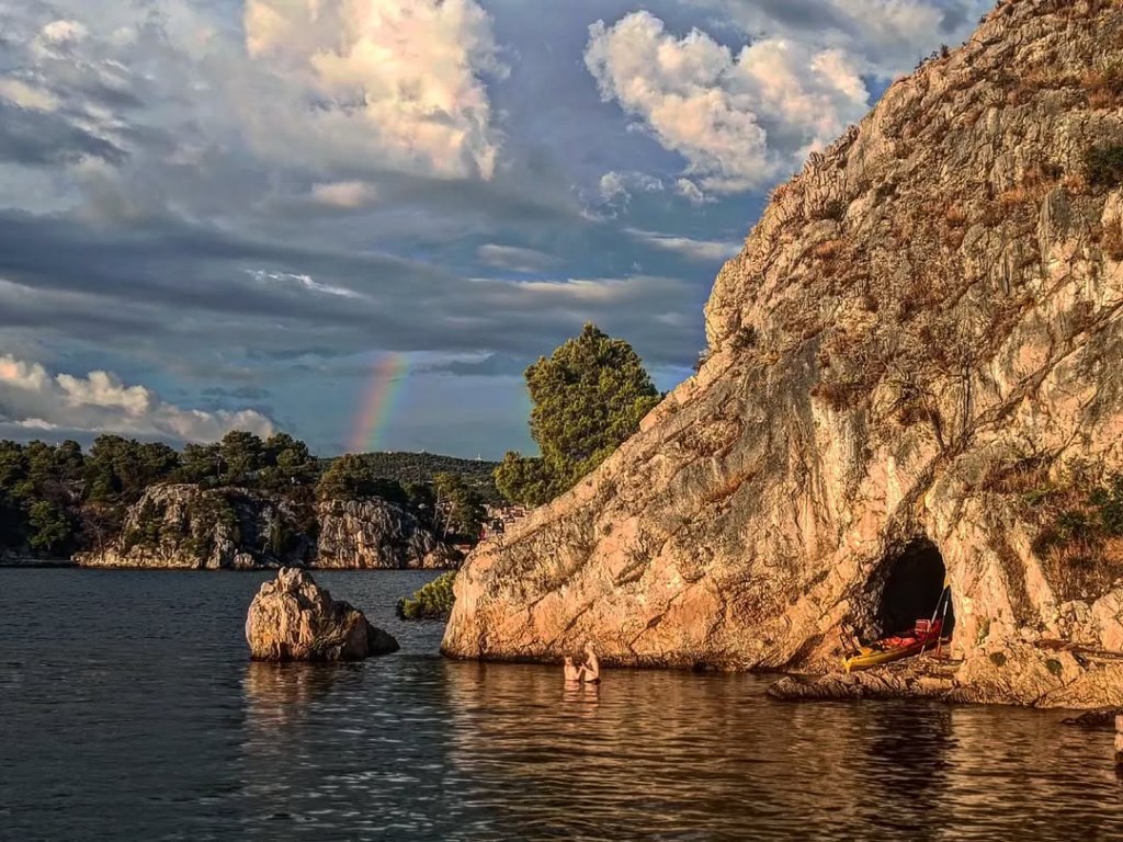 Tourists paddling kayaks near the UNESCO-protected fortress of St. Nicholas